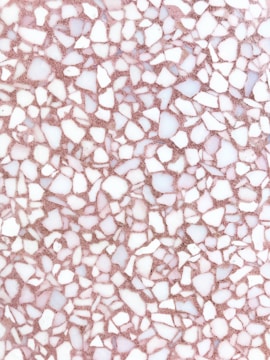 Close-up of a polished terrazzo floor with natural stone aggregates.