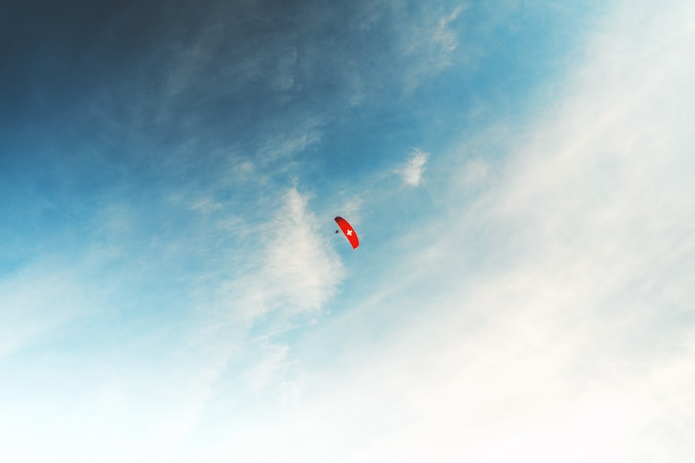 a person flying a kite high in the sky