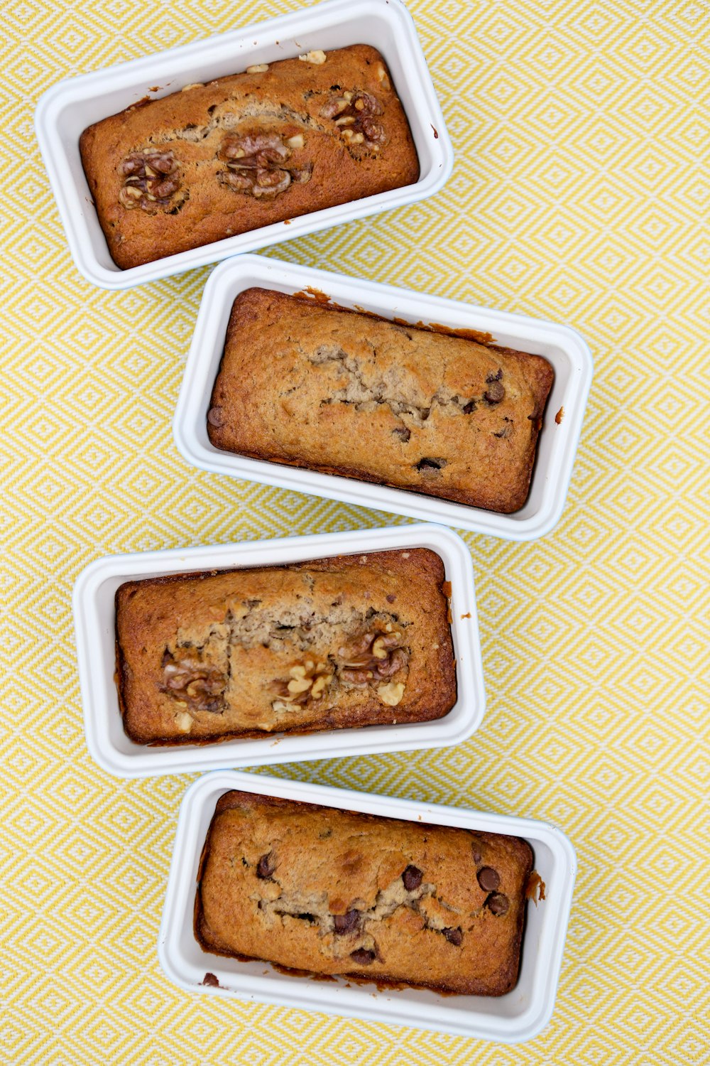 four brownies on yellow textile