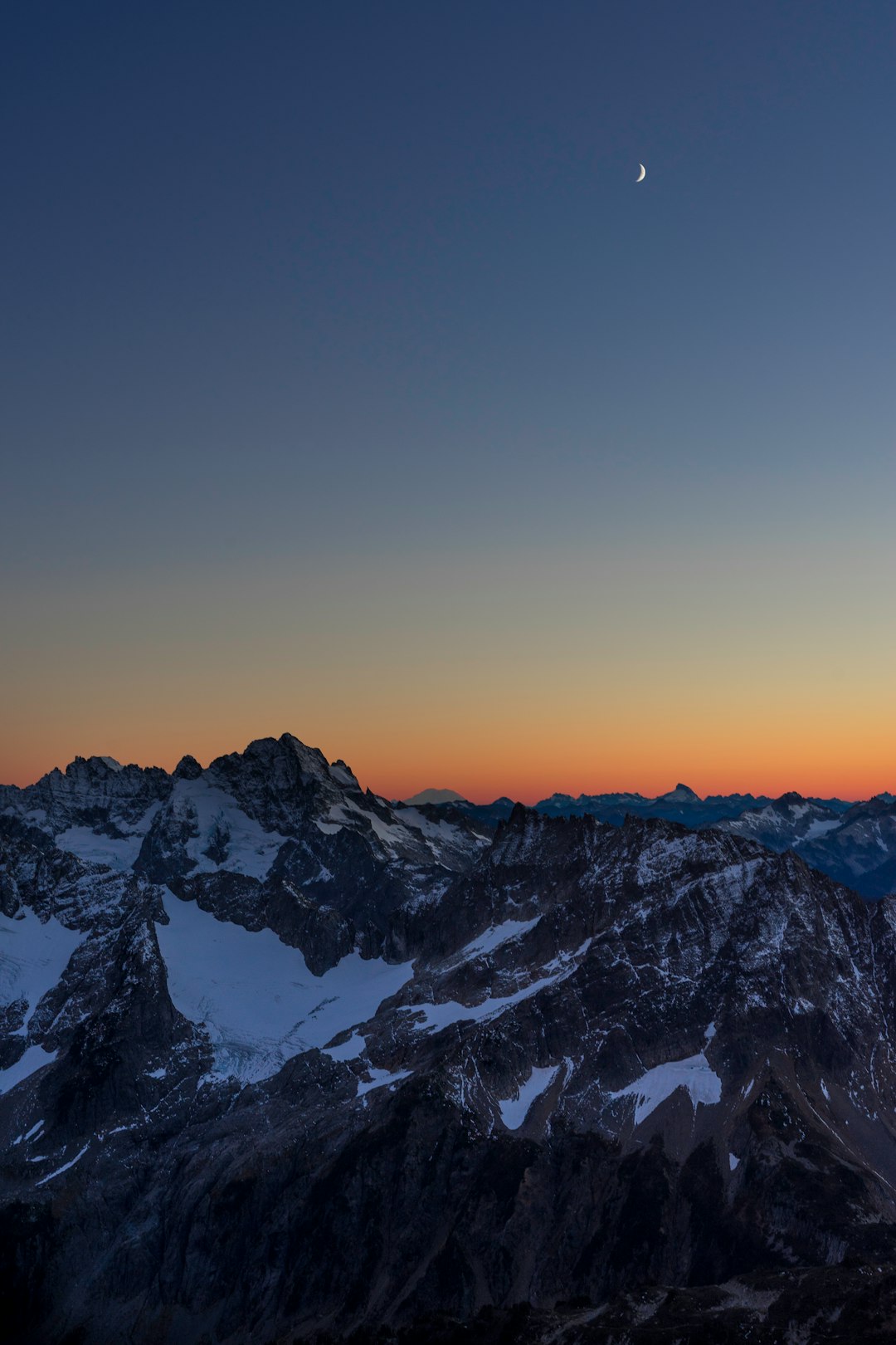 snow capped mountain during golden hour