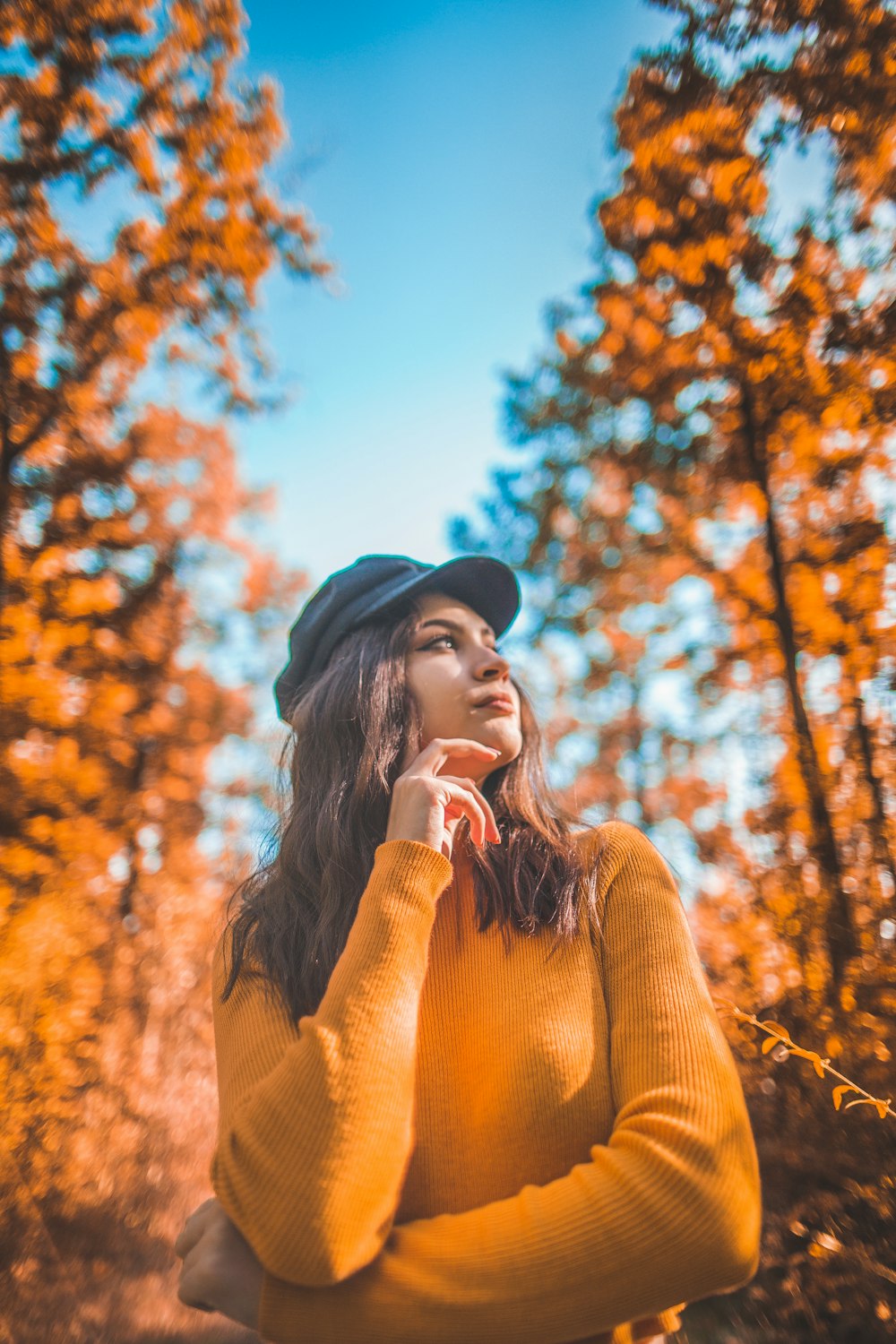 woman standing on forest during daytime