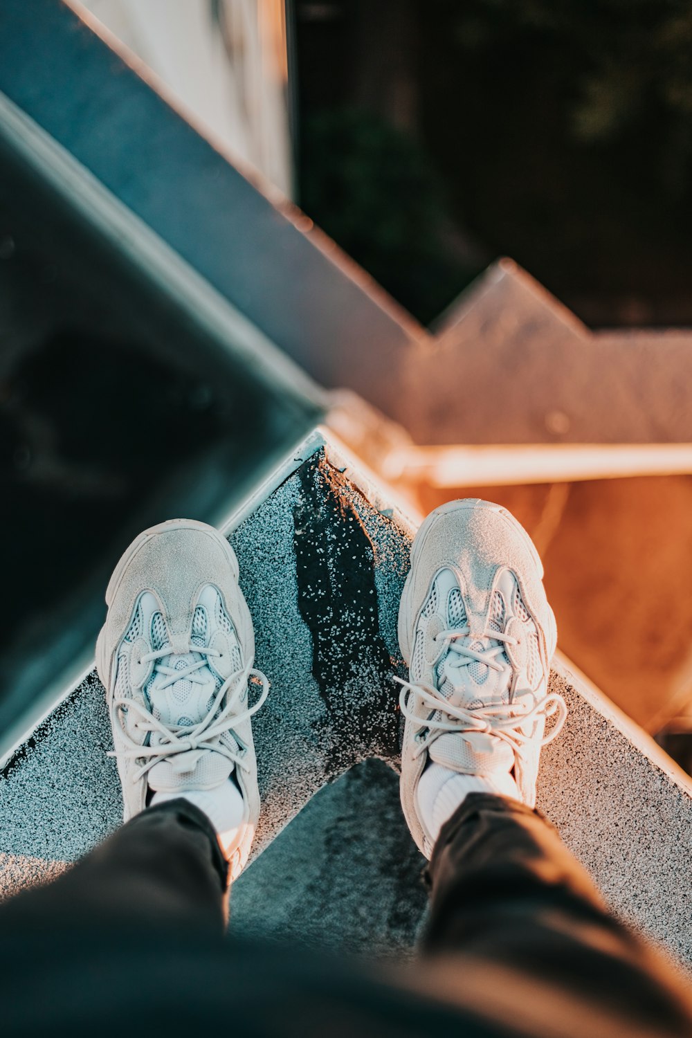 person wearing white sneakers