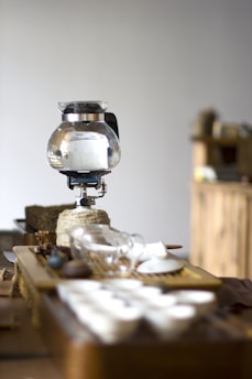 A cozy kitchen scene featuring a modern electric kettle surrounded by fresh tea leaves and cups.