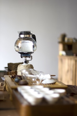 A cozy kitchen scene with Japanese daily necessities neatly arranged on a wooden table.