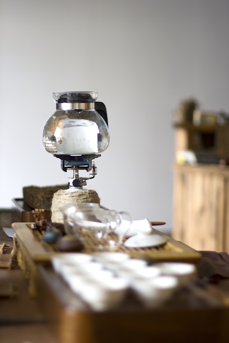 A cozy kitchen scene with Japanese daily necessities neatly arranged on a wooden table.
