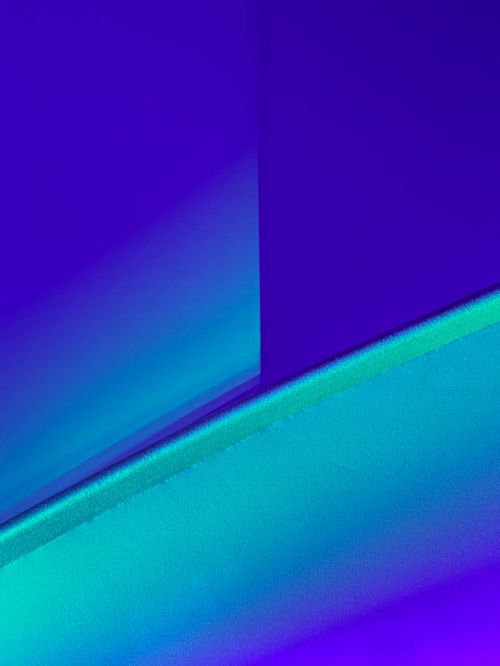 a blue and purple background with a curved edge