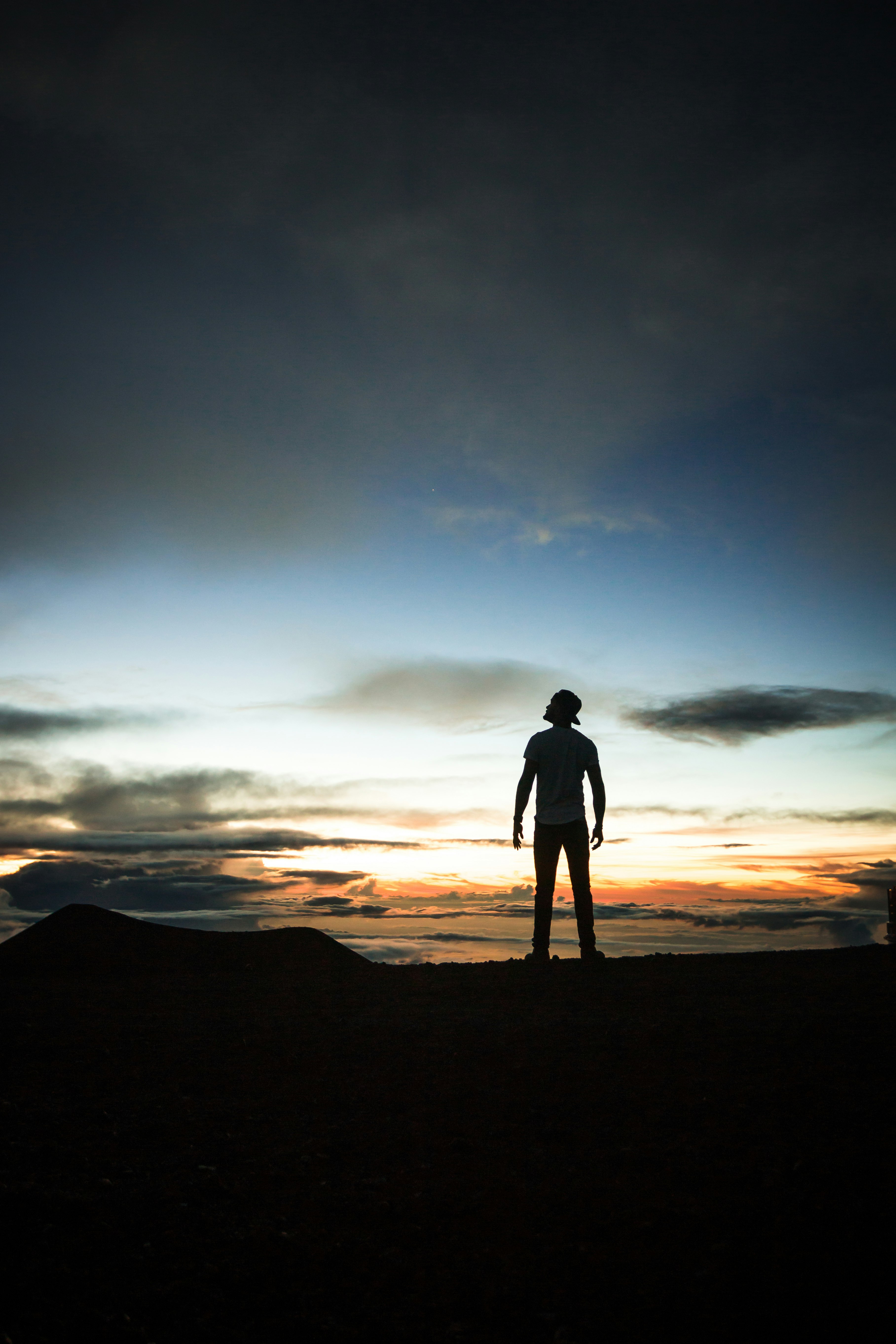 silhouette of man during sunset