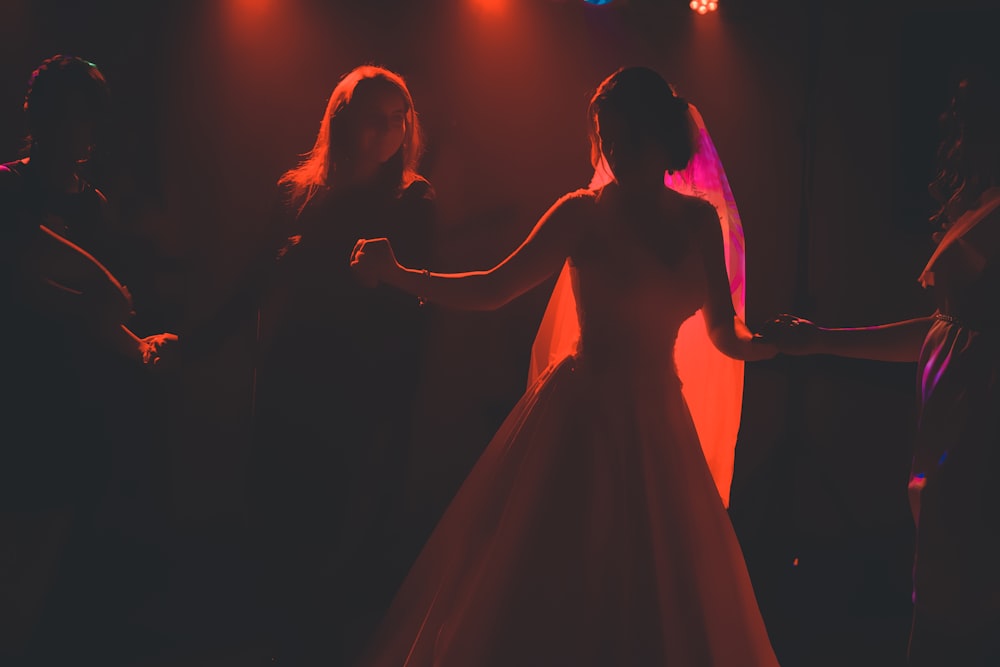 woman wearing wedding gown in dim light