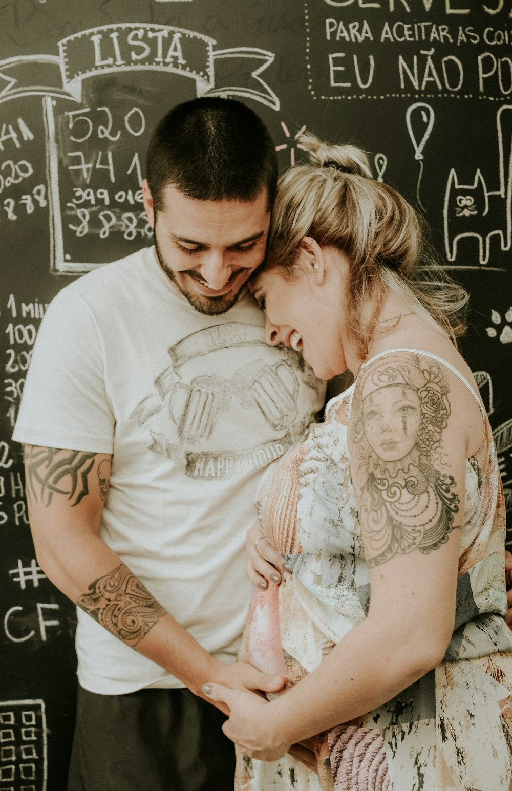 man and woman standing and smiling