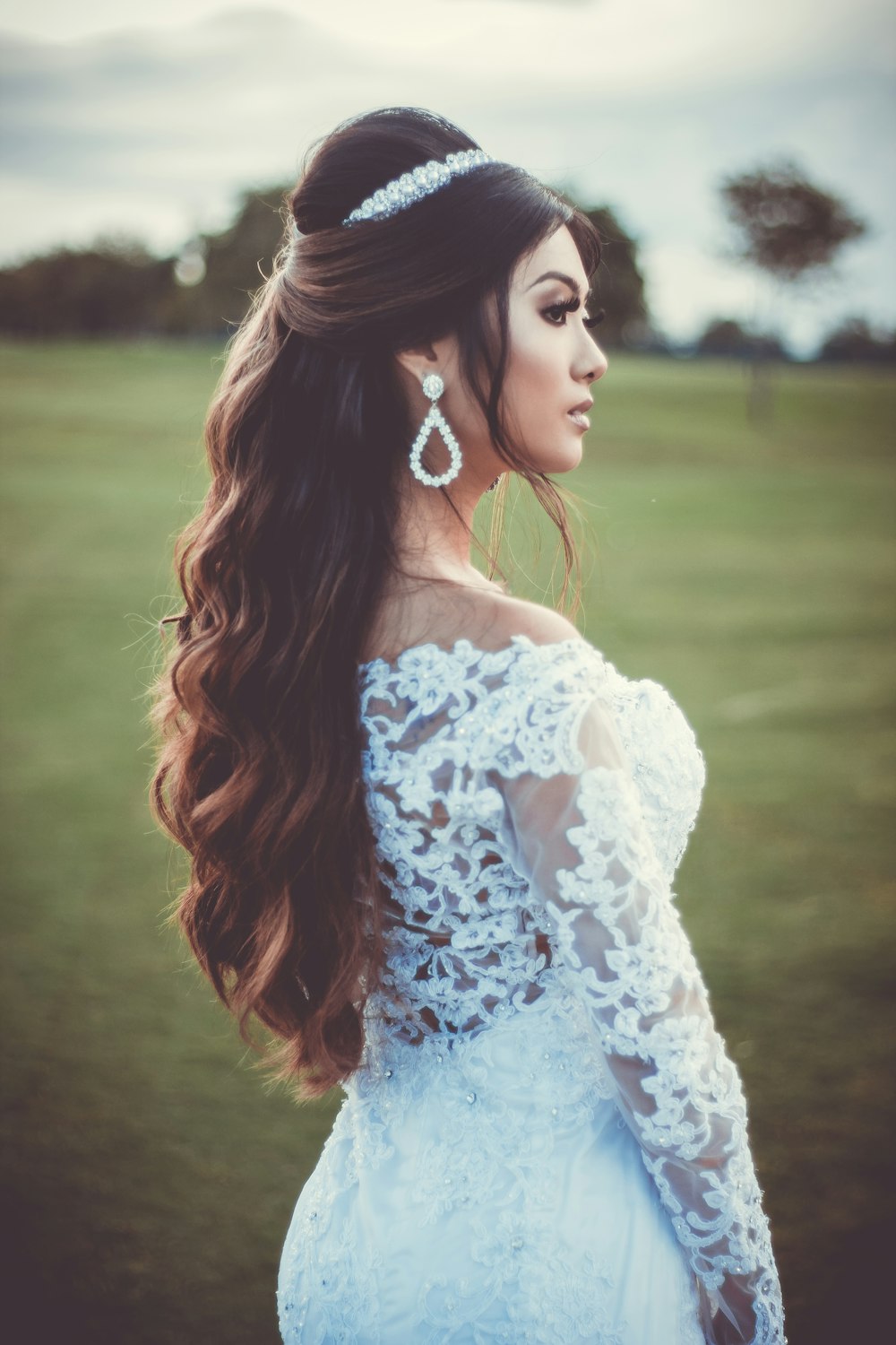 woman in white wedding dress standing on focus photography