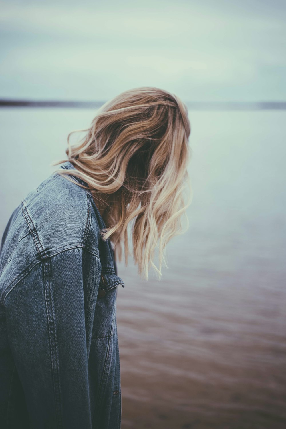 person in blue denim jacket