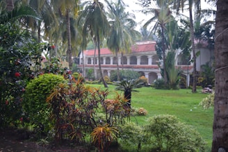 A lush garden with workers tending to plants.