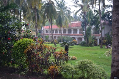 A lush garden with workers tending to plants.