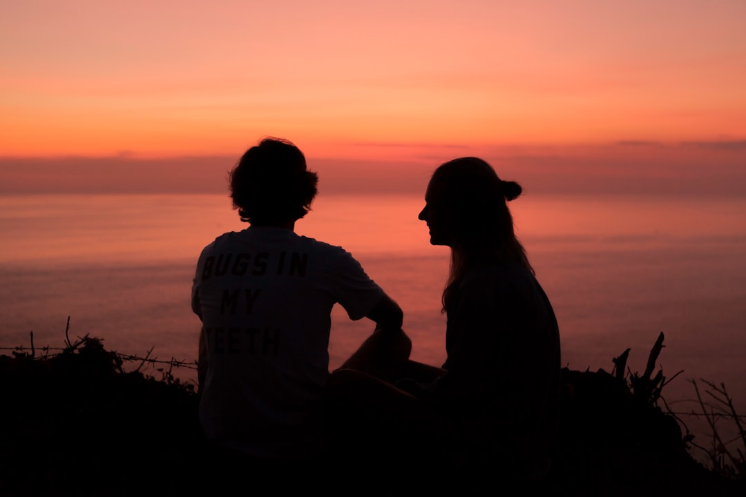 silhouette of 2 person during golden hour