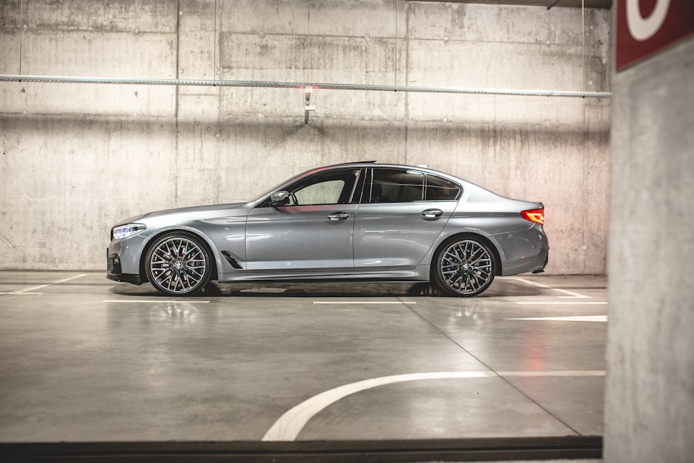 grey BMW sedan on parking space