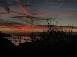 Sunset view over the Chesapeake Bay with sailboats anchored.
