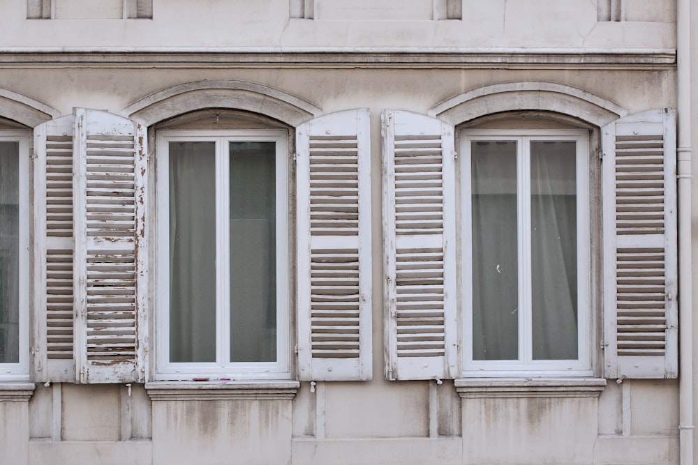 white window with louver doors