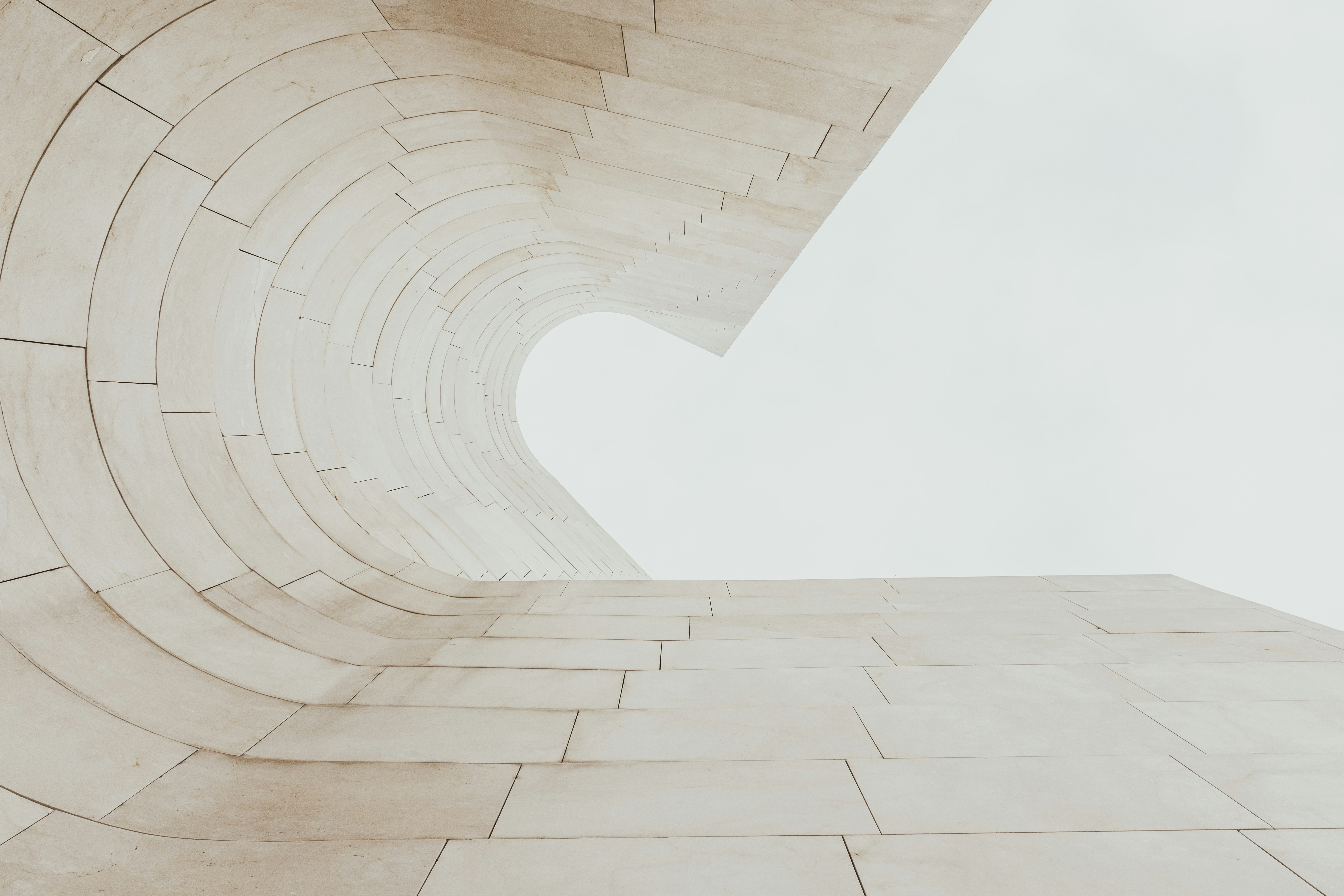 low angle photography of beige wall