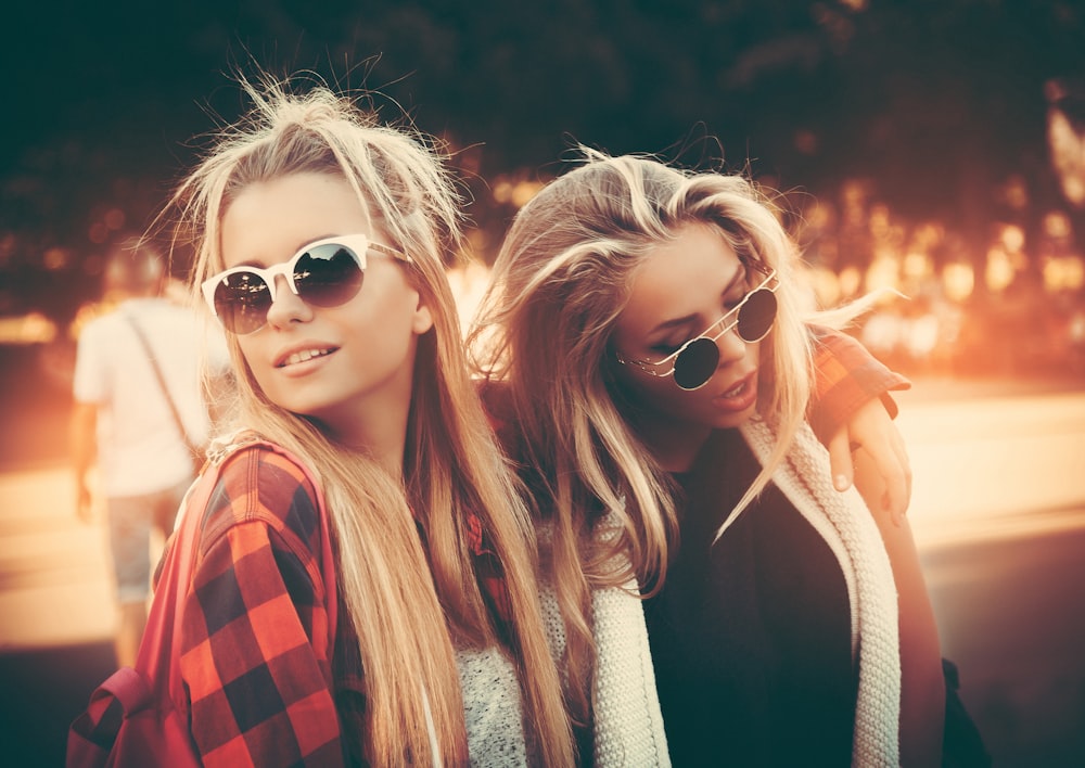 two women wearing sunglasses