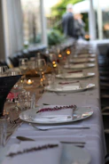 Elegant linen tablecloth spread over a dining table with soft lighting.