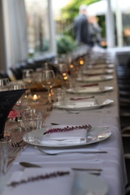 A couple enjoying a romantic dinner at a beautifully set table.