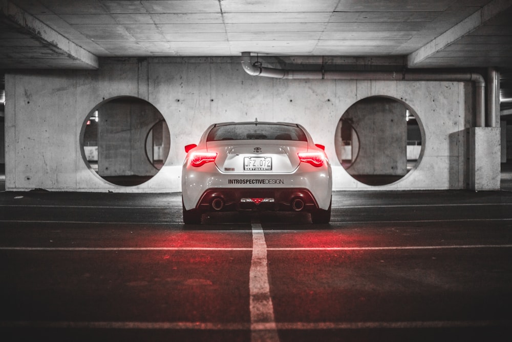 white vehicle parked in garage