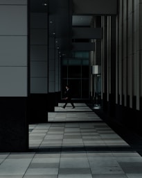 man standing in hallways