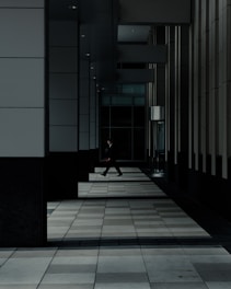 man standing in hallways
