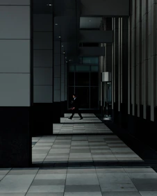 man standing in hallways