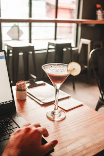 clear martini glass with beverage