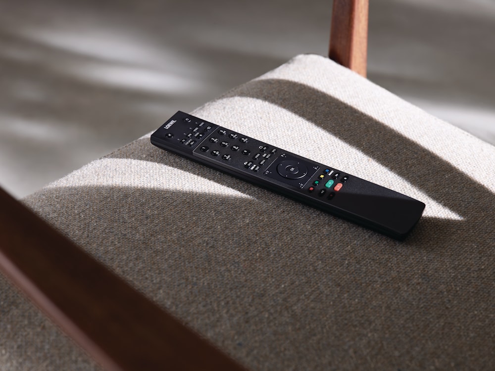 black remote control on chair