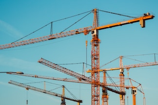 brown tower cranes