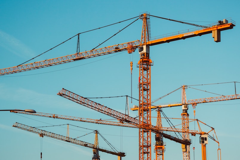 brown tower cranes