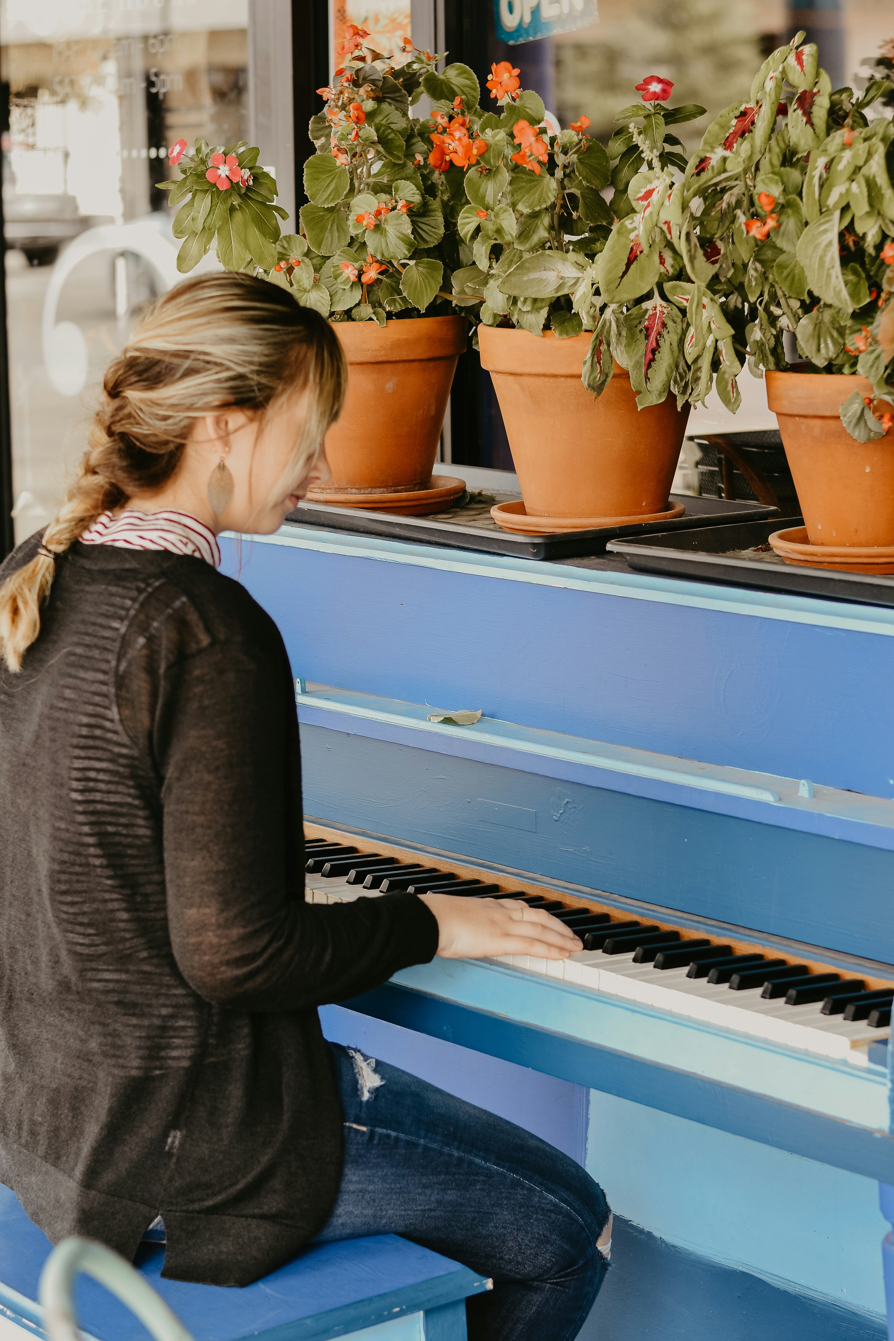 woman playing spinet piano