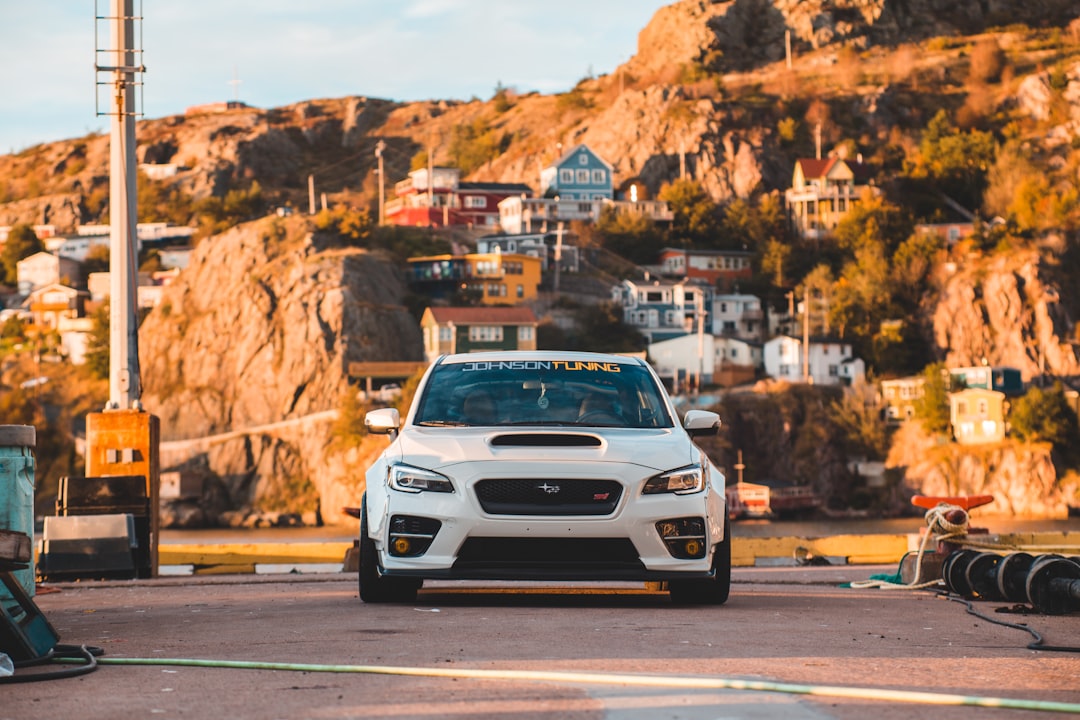 white Ford vehicle near mountain