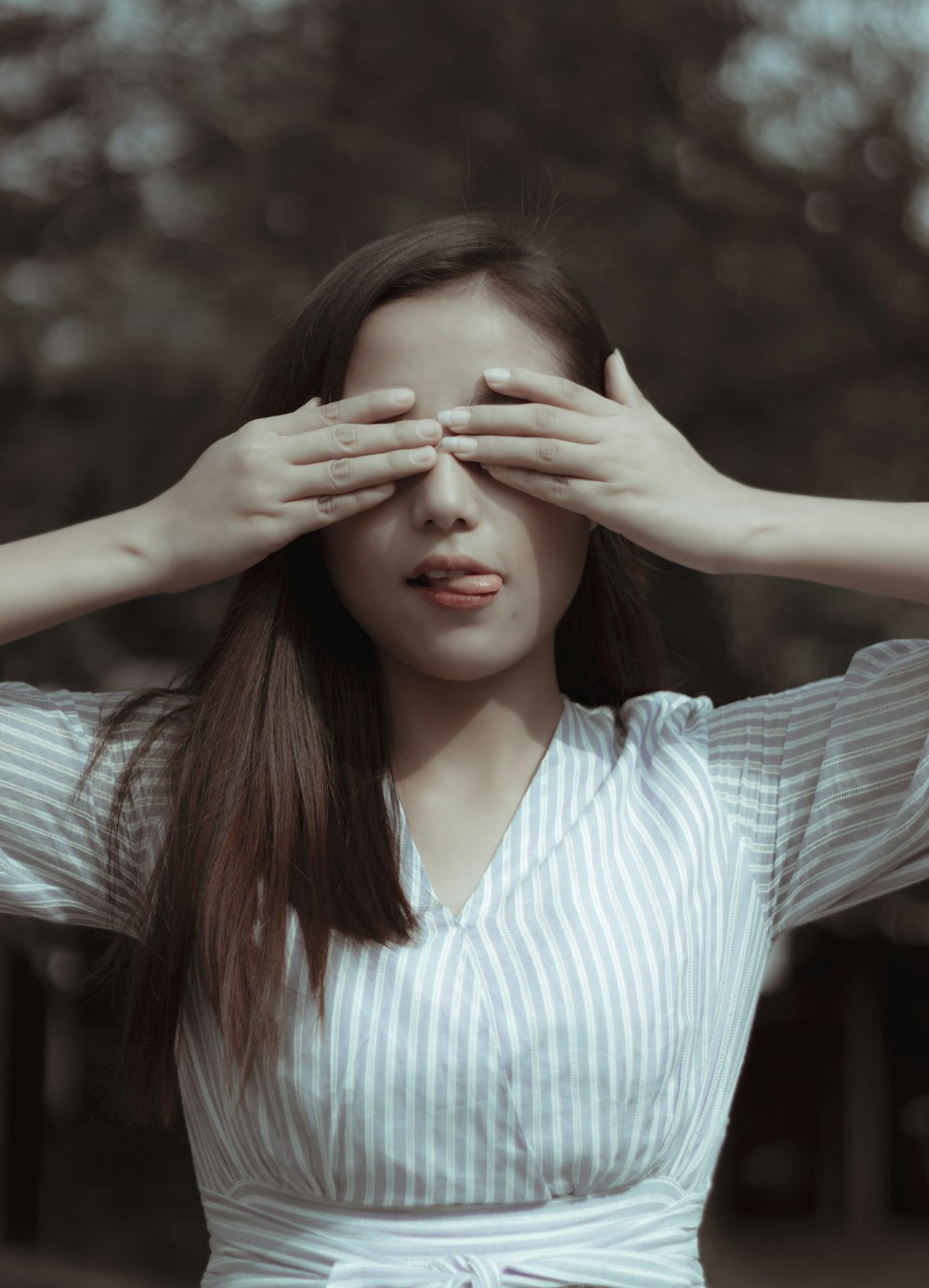 woman covering eyes on focus photography