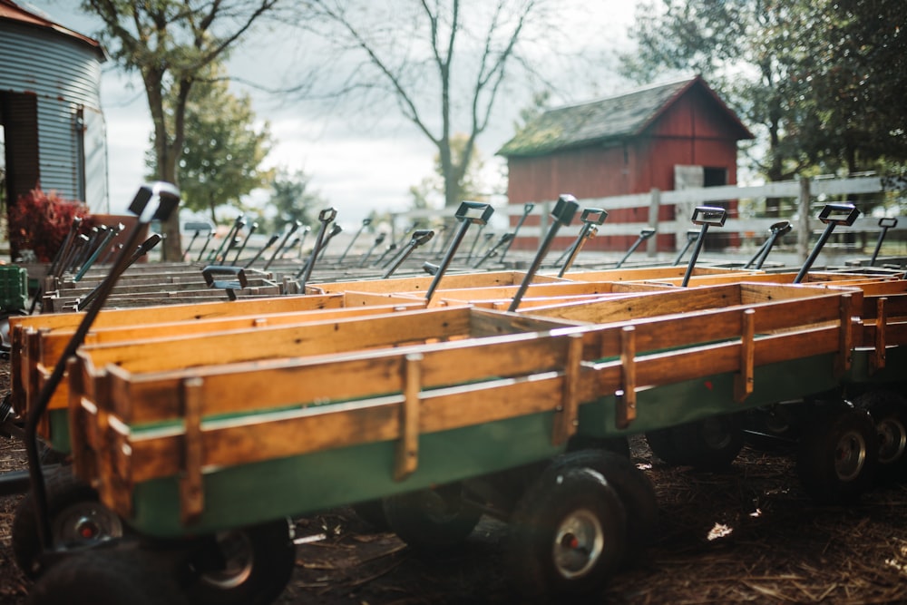 lined green-and-brown carts in barn