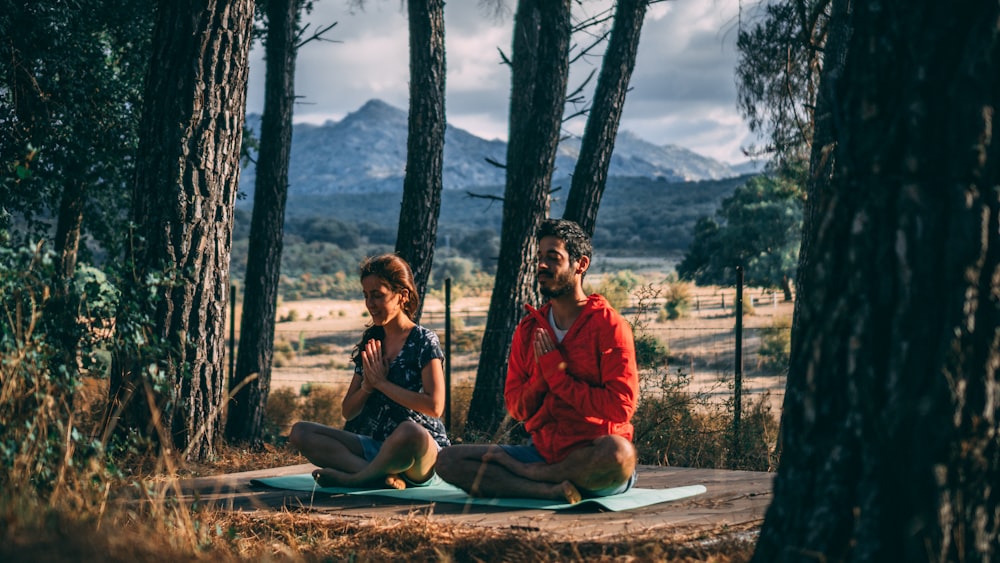 female and male sitting on outdoors