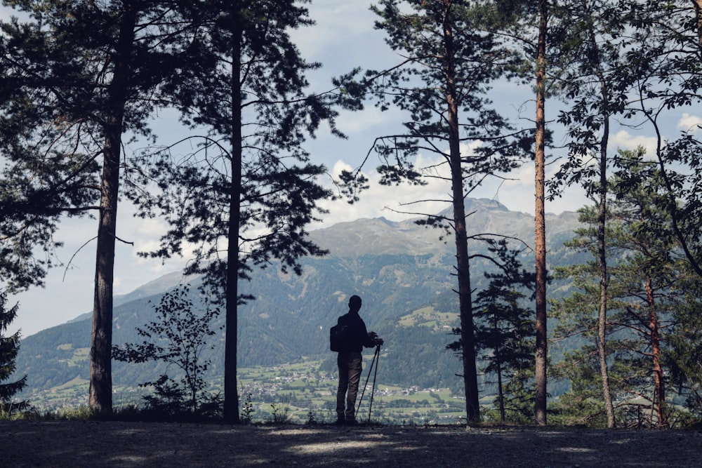 silhouette of man standing on focus photography