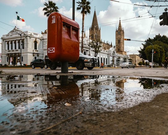 red mail post beside road in Guadalajara Mexico