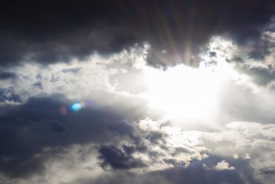 A sunrise breaking through clouds, representing new beginnings.