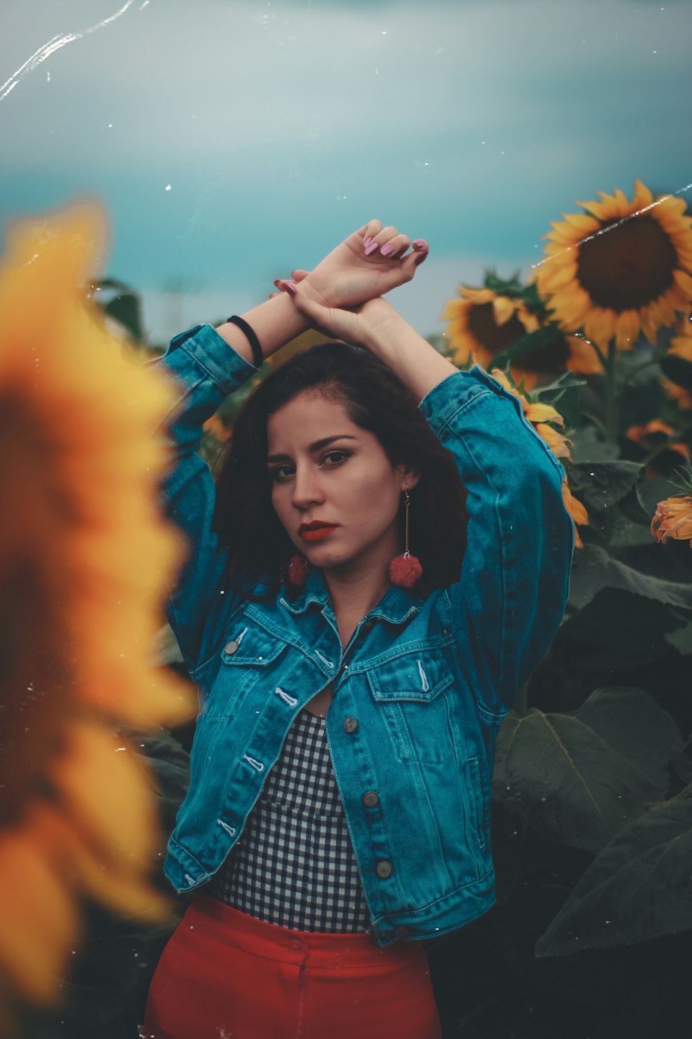 woman standing in sunflower field