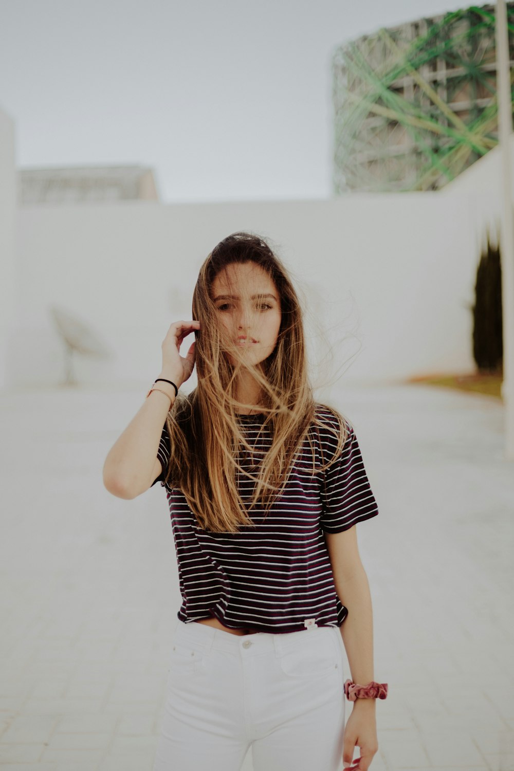 woman standing near white wall