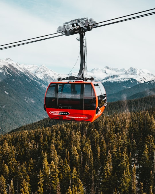 red and black cable car in Whistler Canada