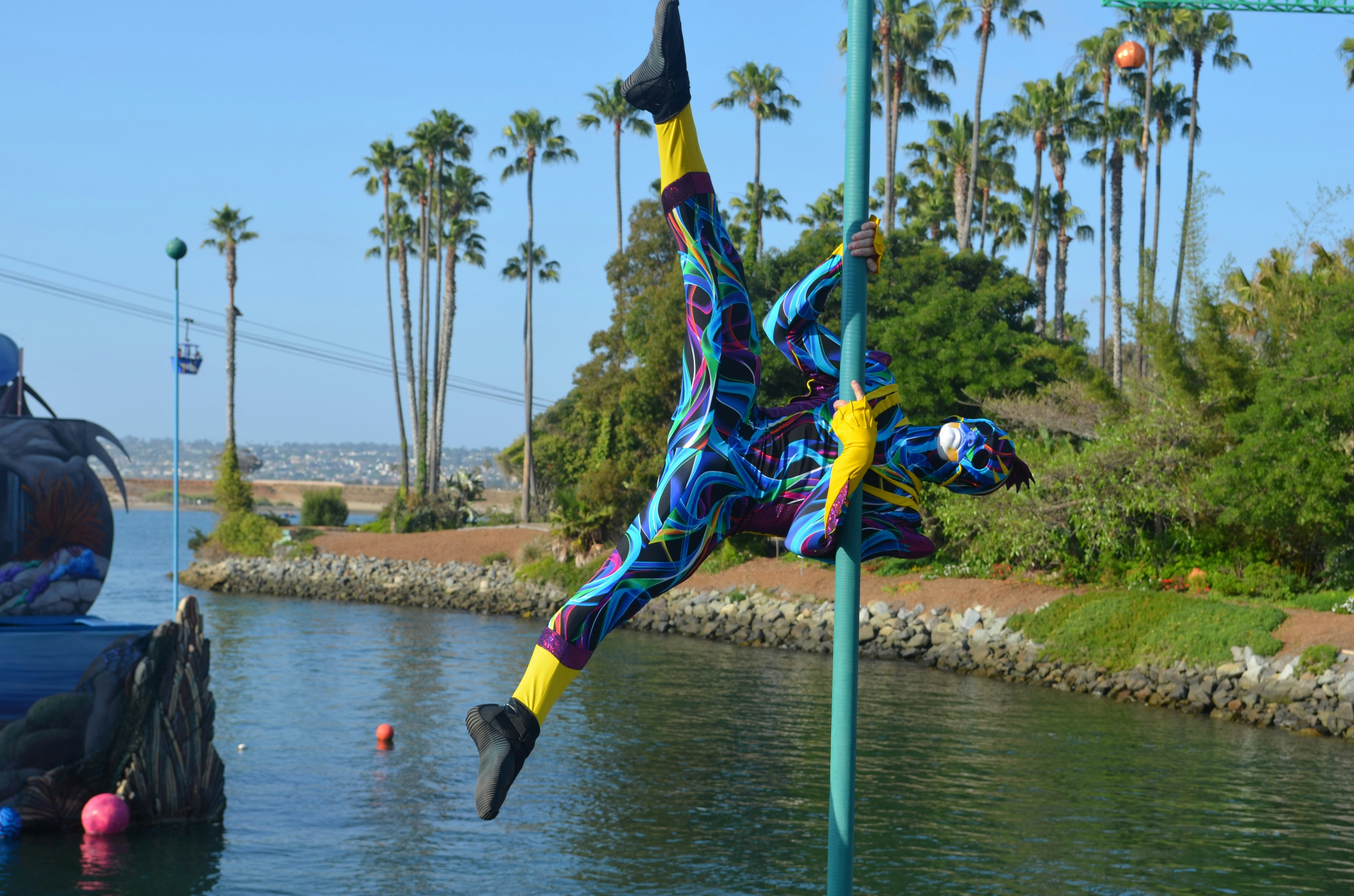 La Perle aquatic theater show with acrobats performing over water pool