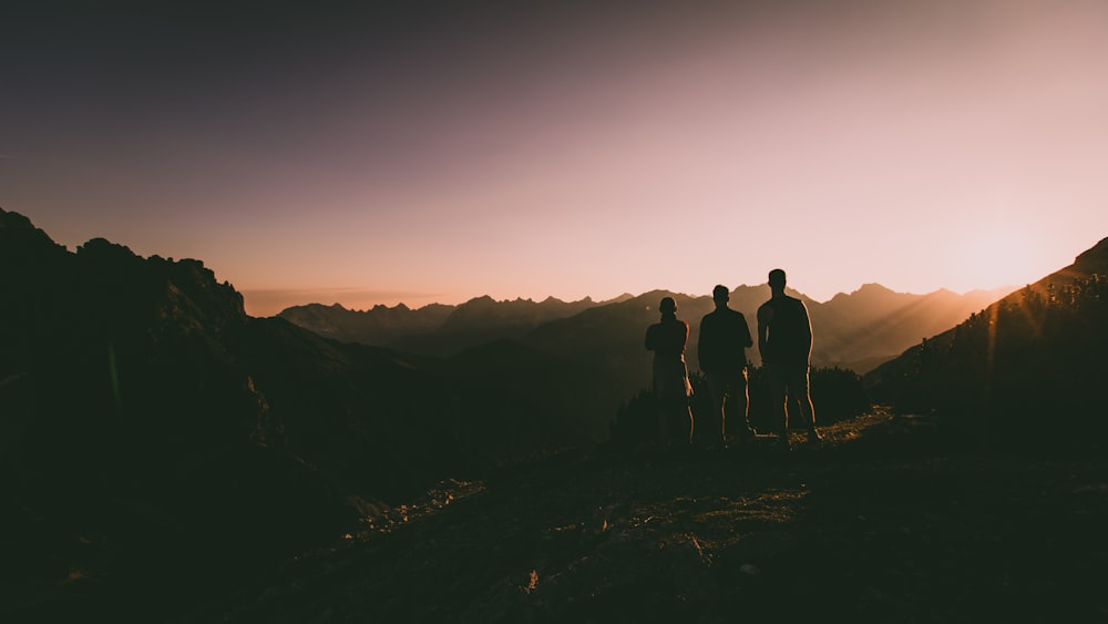 silhouette of three persons