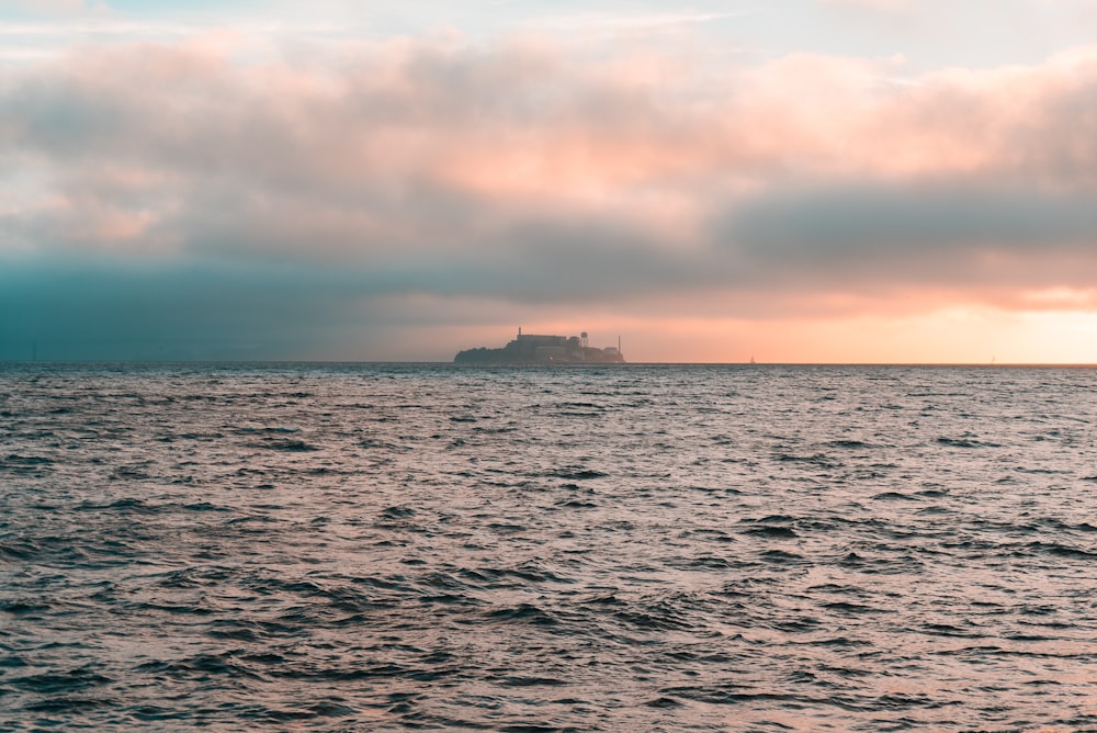 calm sea with ship during daytime