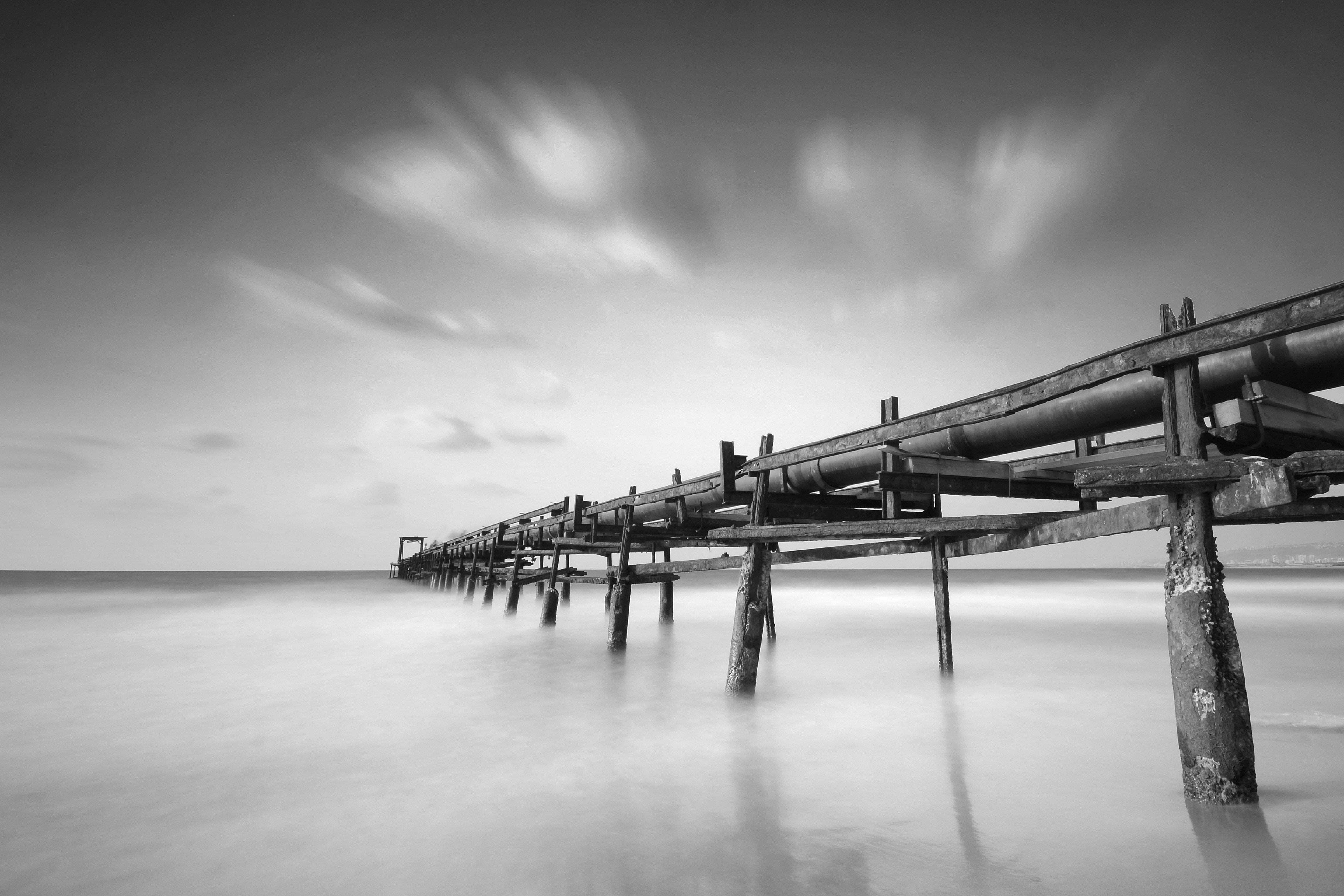 grayscale wooden bridge