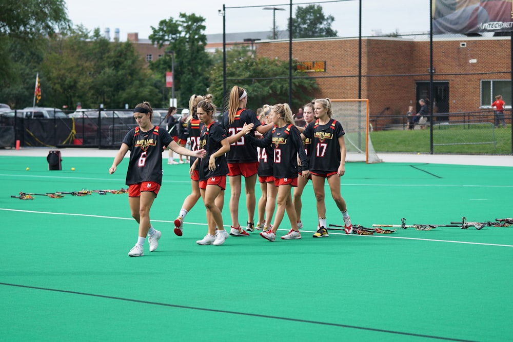 group of woman standing on the field