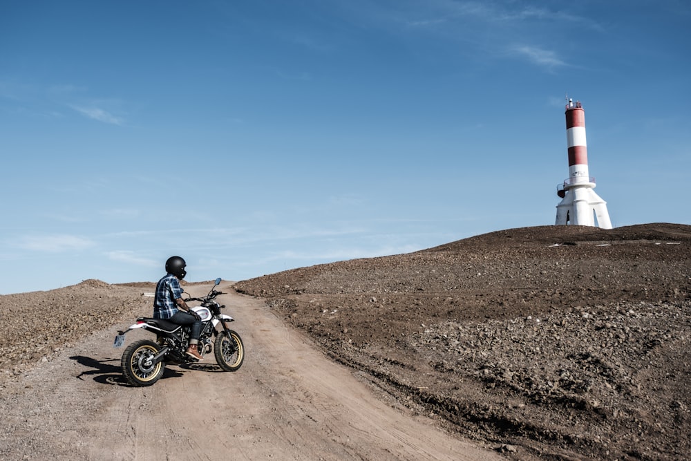 man sitting on the motorcycle